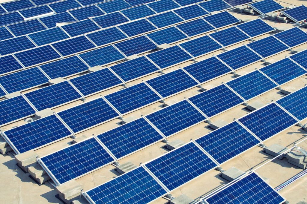 Solar panel energy plant on flat roof under construction